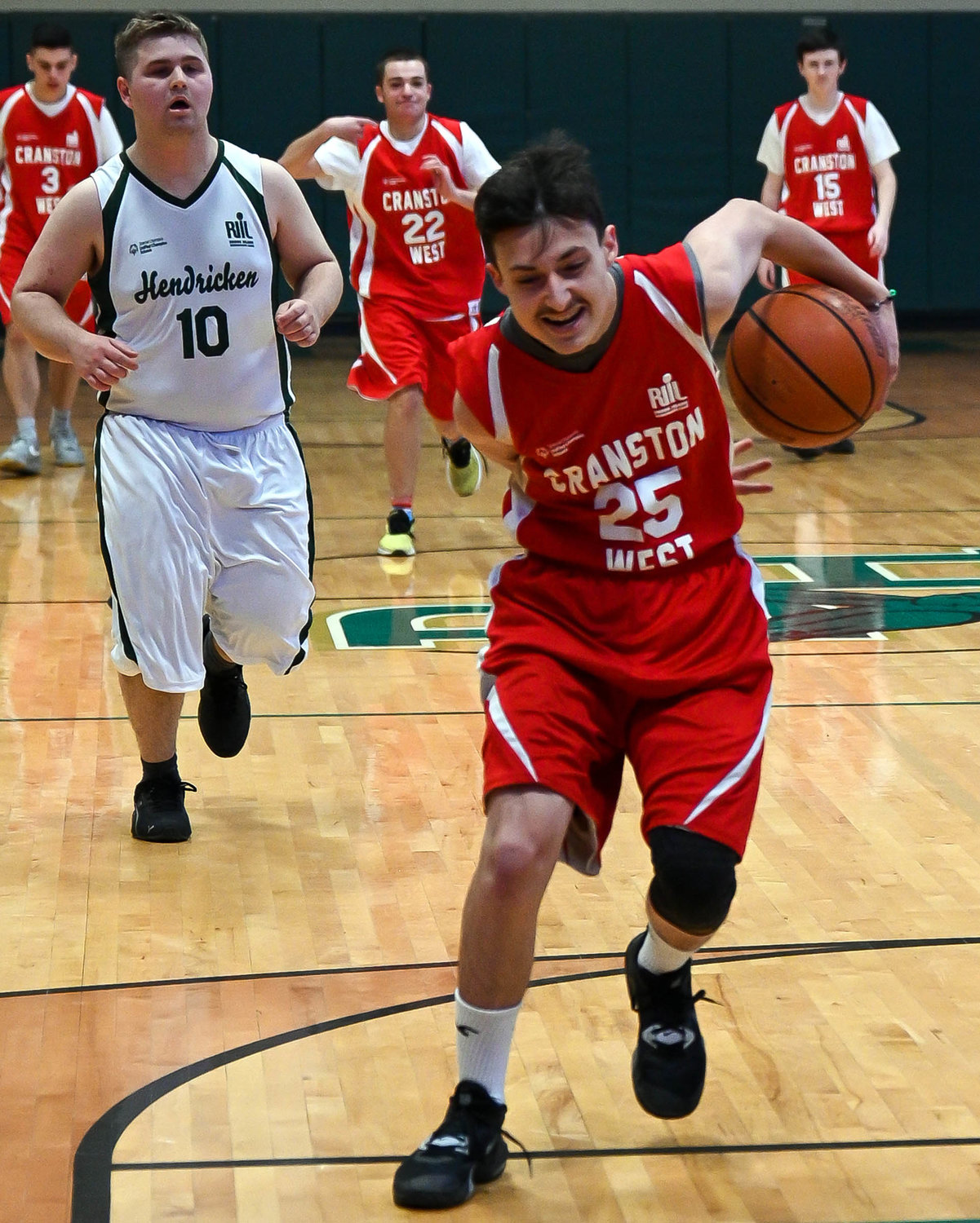 BEHIND THE BACK: Cranston West’s Zachary Archambault dribbles.